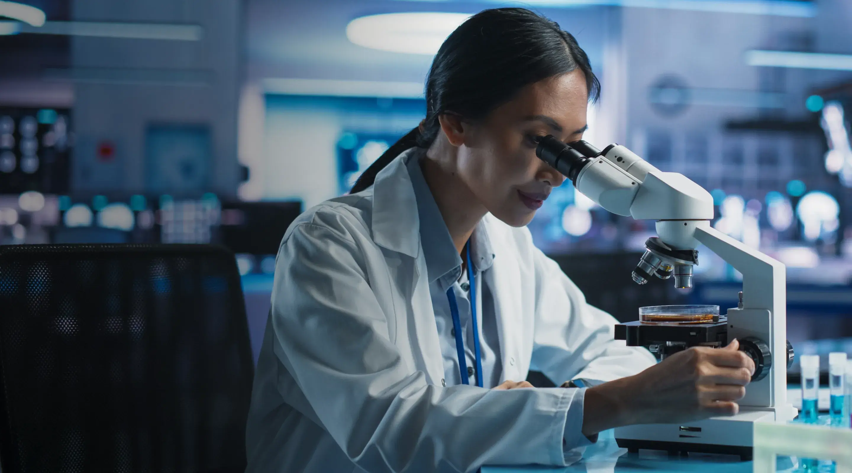 woman-looking-into-microscope
